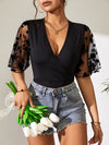 Black Lace Bodysuit - Flutter Sleeves - Semi-Sheer - Moderate Stretch Apparel & Accessories > Clothing > Tops > Bodysuits Bodysuit Dylan Studio Flutter Flutter Sleeve Lace Ship From Overseas Sleeve Sleeve Bodysuit Surplice sync-pinterest T V