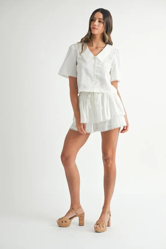 Chic Collared Button-Down Crop Top and Skort Set with Lace Detail Apparel & Accessories > Clothing > Outfits & Sets autopostr_pinterest_72819 MABLE Only Available for U.S. Residents Ship from USA sync-pinterest